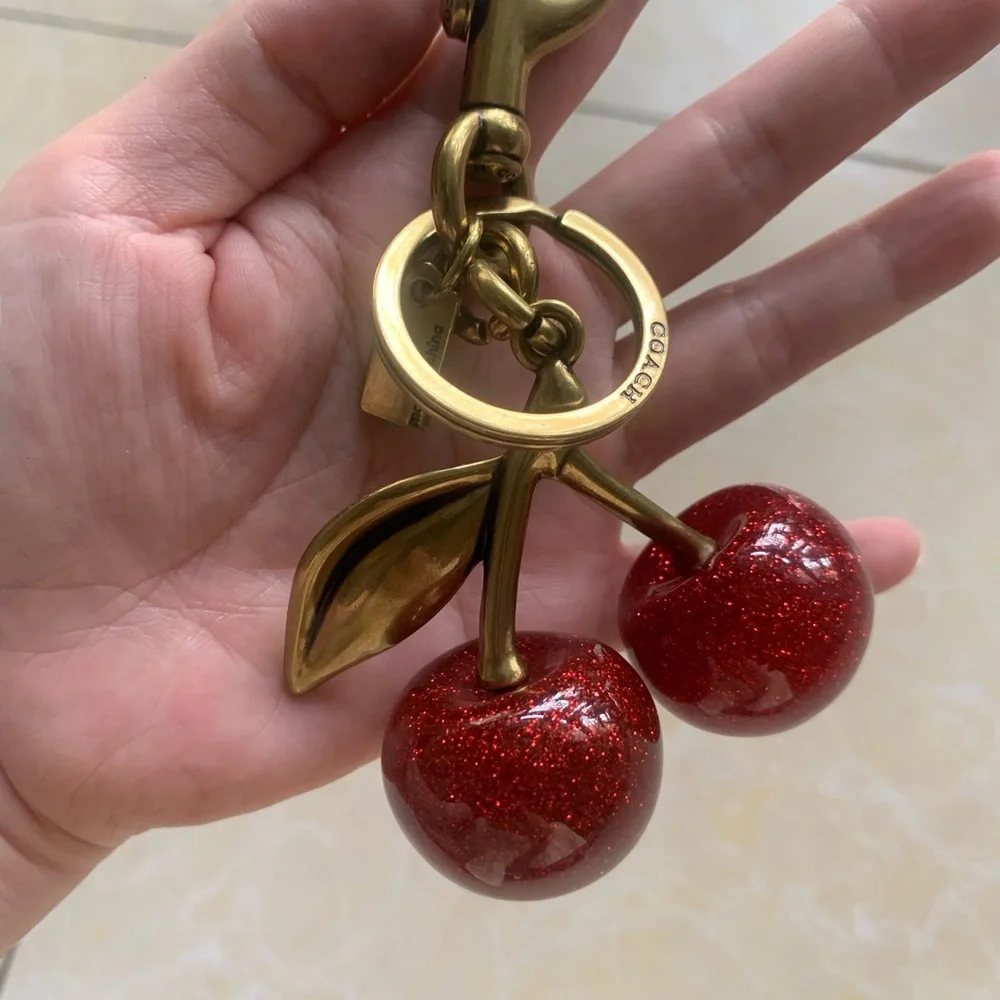 Coach Gold-Tone Keychain with Red Glitter Cherry Charm